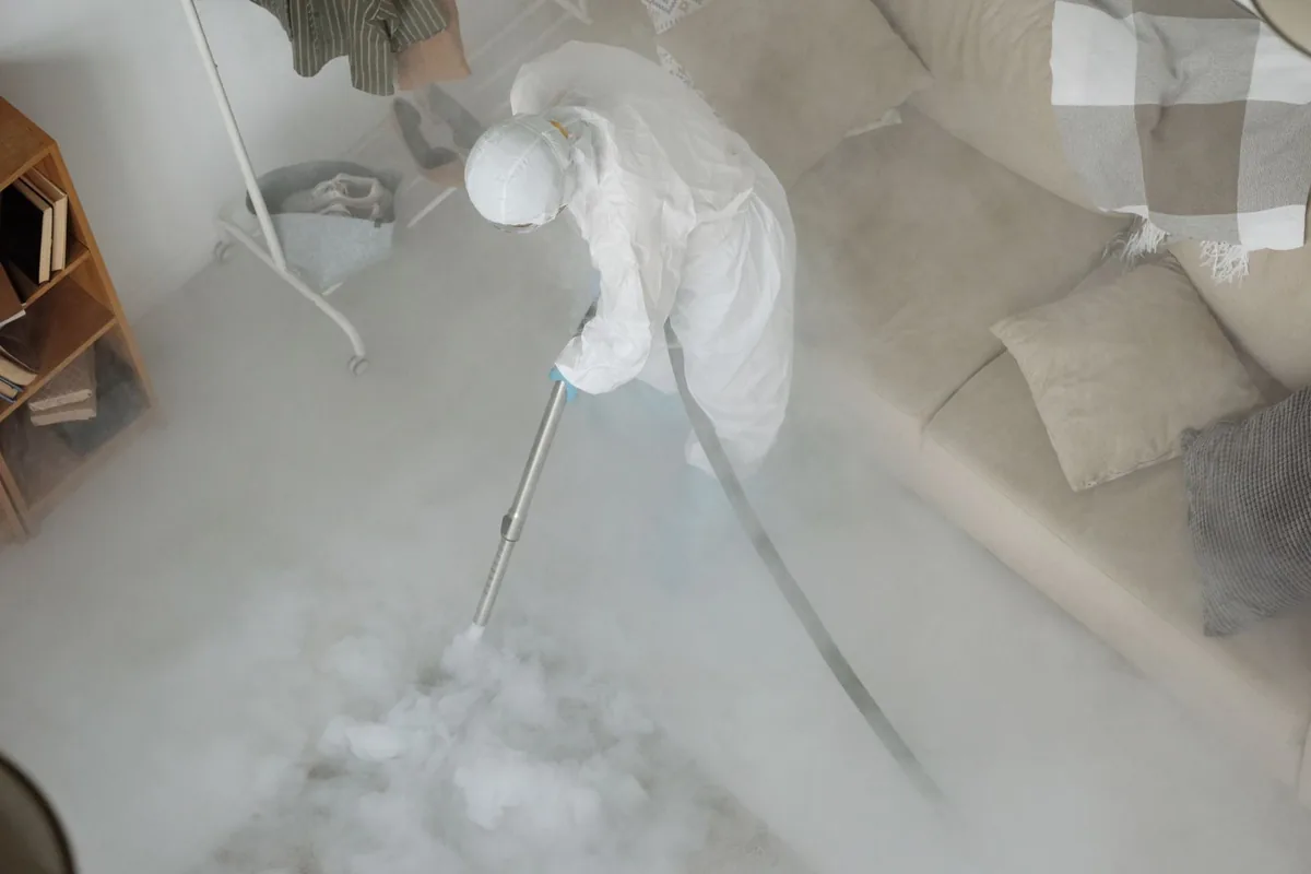 Biohazard cleanup technician in protective equipment, Hendron, KY